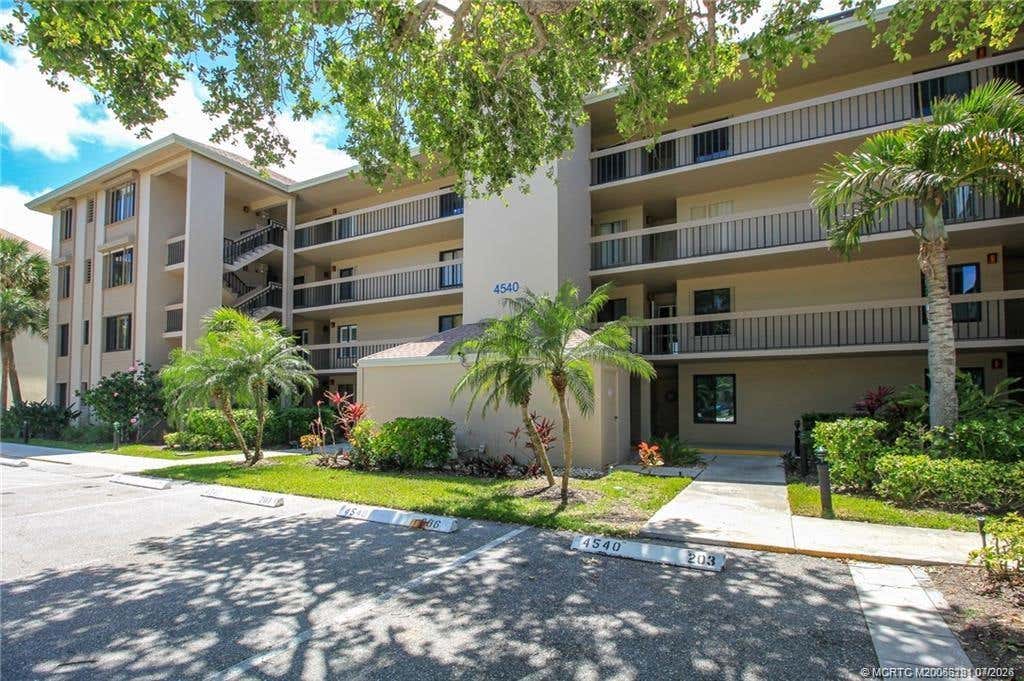 Photo of 4540 NE Sandpebble Trace #203, Stuart, FL 34996 (MLS # M20056291)