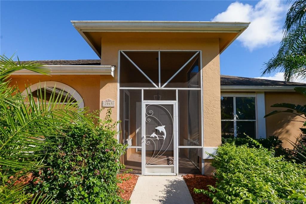 Photo of 2065 SW Beekman Street, Port Saint Lucie, FL 34953 (MLS # M20037040)