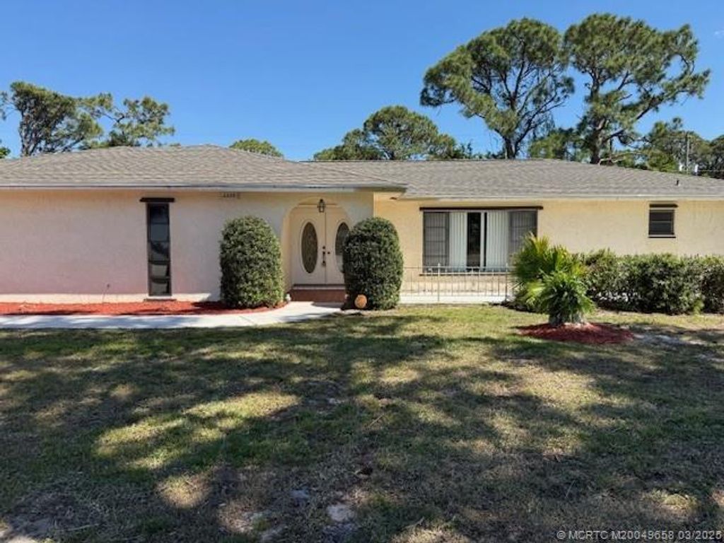 Photo of 2225 SE Adobe Street, Port Saint Lucie, FL 34952 (MLS # M20049658)