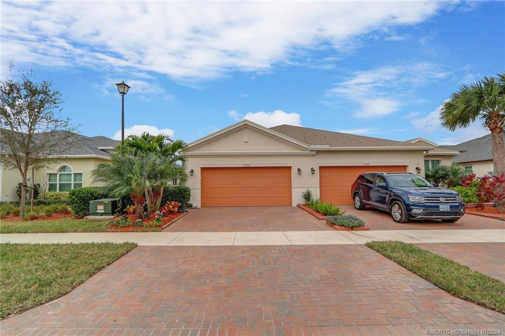 Photo of 12914 SW Lake Fern Circle, Port Saint Lucie, FL 34987 (MLS # M20045951)