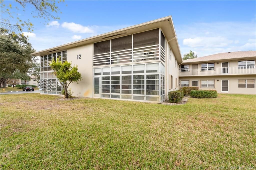 Photo of 12 Lake Vista Trail #102, Port Saint Lucie, FL 34952 (MLS # M20054365)