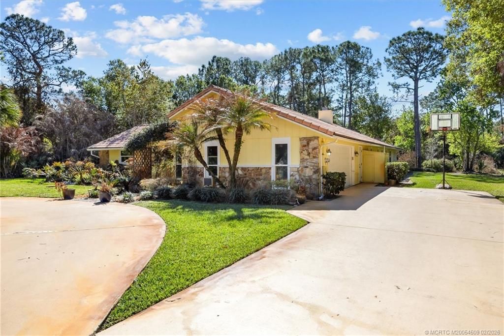 Photo of 1918 SW Crane Creek Avenue, Palm City, FL 34990 (MLS # M20054509)