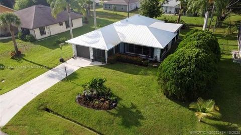 Photo of 838 SE Cavern Avenue, Port Saint Lucie, FL 34983 (MLS # M20052484)
