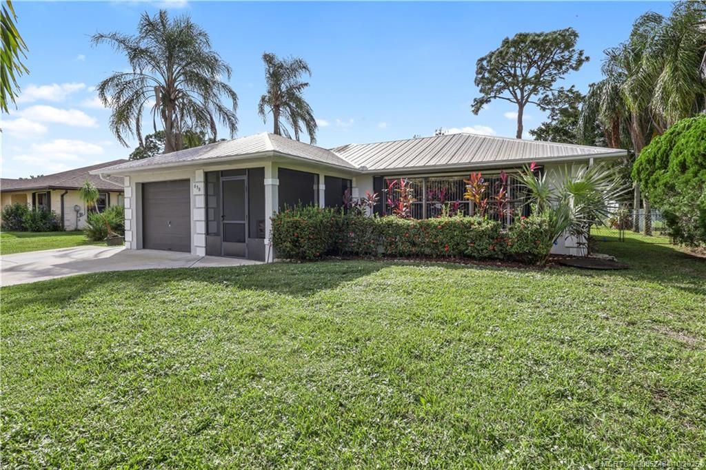 Photo of 838 SE Cavern Avenue, Port Saint Lucie, FL 34983 (MLS # M20052484)