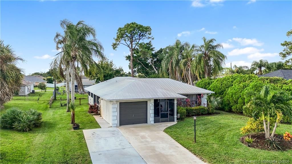 Photo of 838 SE Cavern Avenue, Port Saint Lucie, FL 34983 (MLS # M20052484)