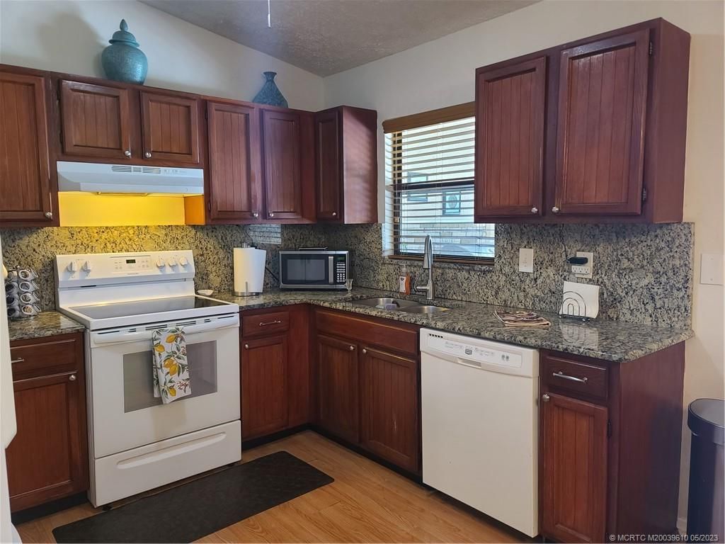 Photo of 379 SW Fairway Avenue, Port Saint Lucie, FL 34983 (MLS # M20039610)