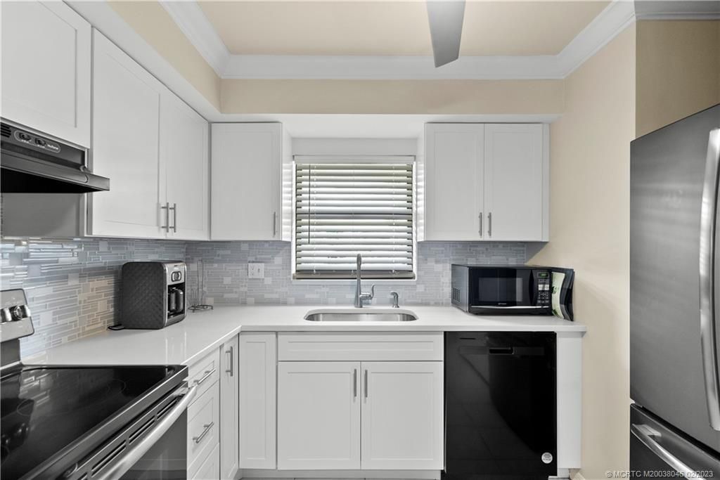 Photo of 4885 SE Capstan Avenue #E-27, Stuart, FL 34997 (MLS # M20038046)