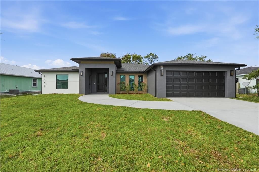 Photo of 1457 SW Dow Lane, Port Saint Lucie, FL 34953 (MLS # M20054735)