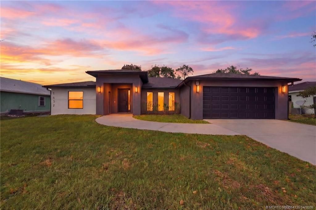 Photo of 1457 SW Dow Lane, Port Saint Lucie, FL 34953 (MLS # M20054735)