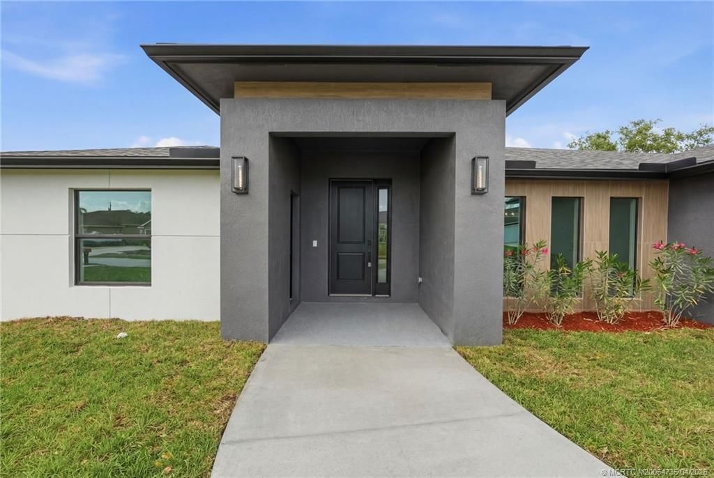 Photo of 1457 SW Dow Lane, Port Saint Lucie, FL 34953 (MLS # M20054735)