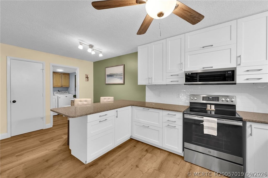 Photo of 6508 SE Windsong Lane, Stuart, FL 34997 (MLS # M20057019)