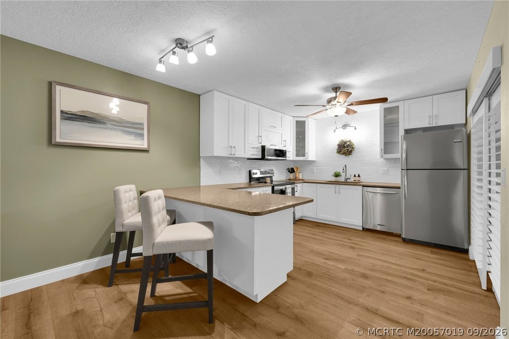 Photo of 6508 SE Windsong Lane, Stuart, FL 34997 (MLS # M20057019)