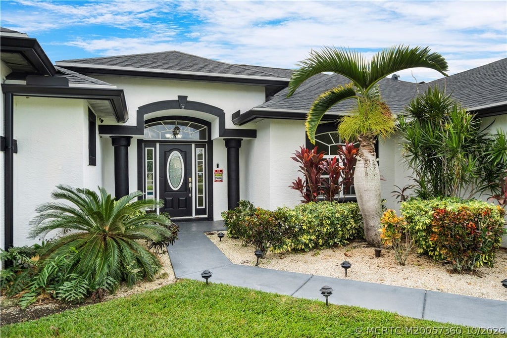 Photo of 1498 SW Bartell Avenue, Port Saint Lucie, FL 34953 (MLS # M20057360)
