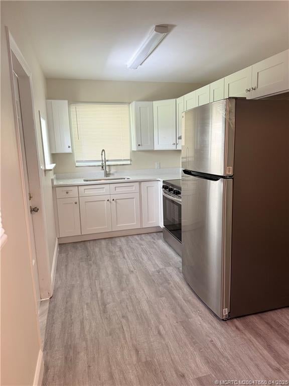 Photo of 140 Banyan Drive, Port Saint Lucie, FL 34952 (MLS # M20047560)