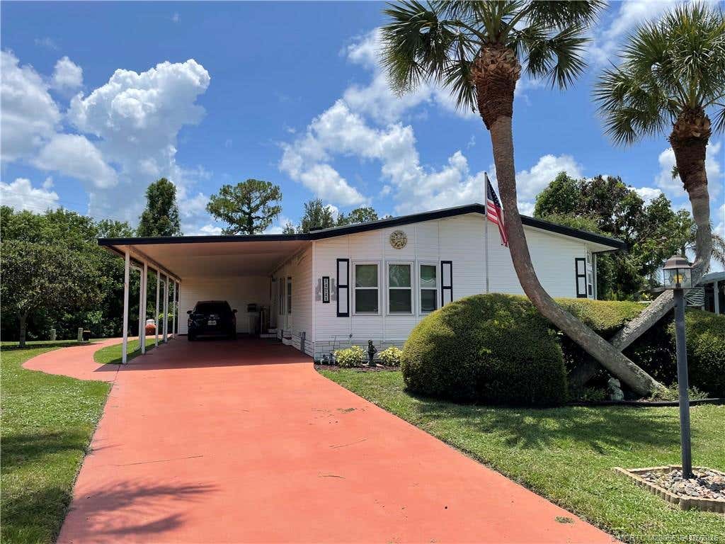 Photo of 14711 SW Divot Drive, Indiantown, FL 34956 (MLS # M20056364)