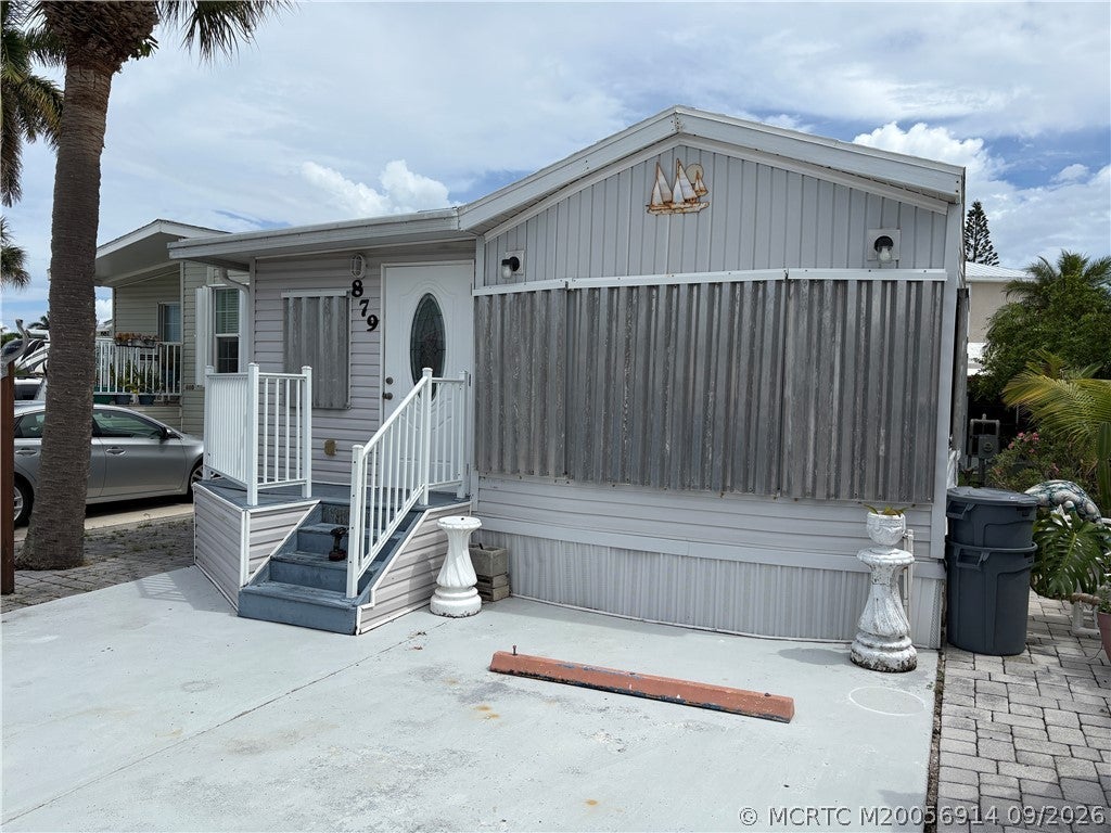 Photo of 879 Nettles Boulevard, Jensen Beach, FL 34957 (MLS # M20056914)
