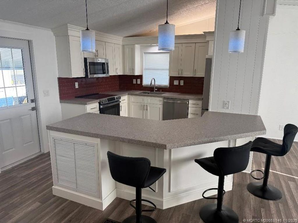 Photo of 15925 Indianwood Circle SW, Indiantown, FL 34956 (MLS # M20053146)