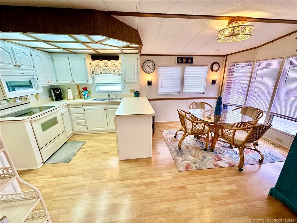 Photo of 855 Nettles Boulevard, Jensen Beach, FL 34957 (MLS # M20045009)