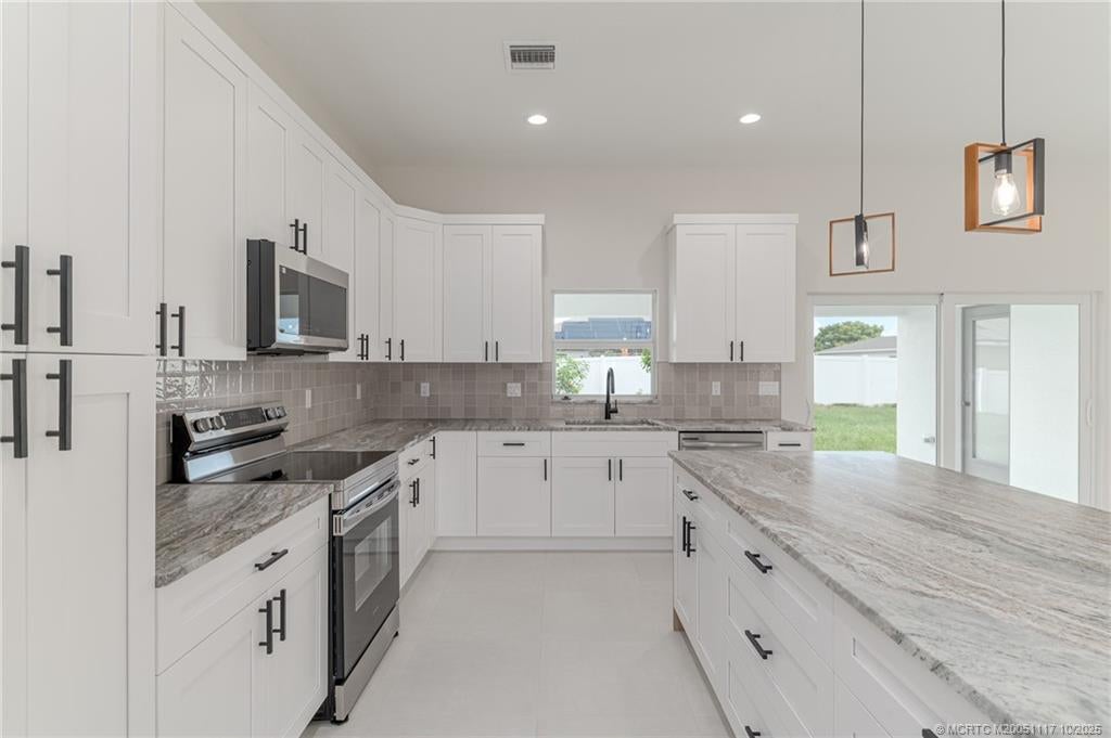 Photo of 513 SW Nautical Avenue, Port Saint Lucie, FL 34984 (MLS # M20051117)