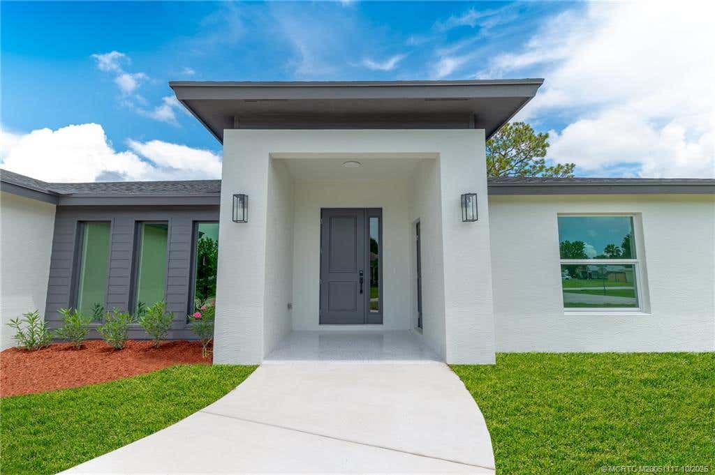 Photo of 513 SW Nautical Avenue, Port Saint Lucie, FL 34984 (MLS # M20051117)