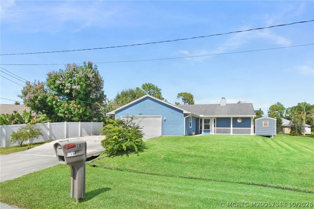 Photo of 2367 SW Madrid Road, Port Saint Lucie, FL 34953 (MLS # M20057343)