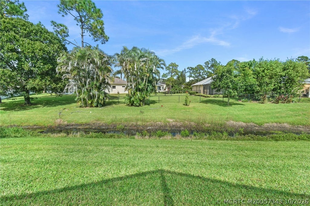 Photo of 2367 SW Madrid Road, Port Saint Lucie, FL 34953 (MLS # M20057343)