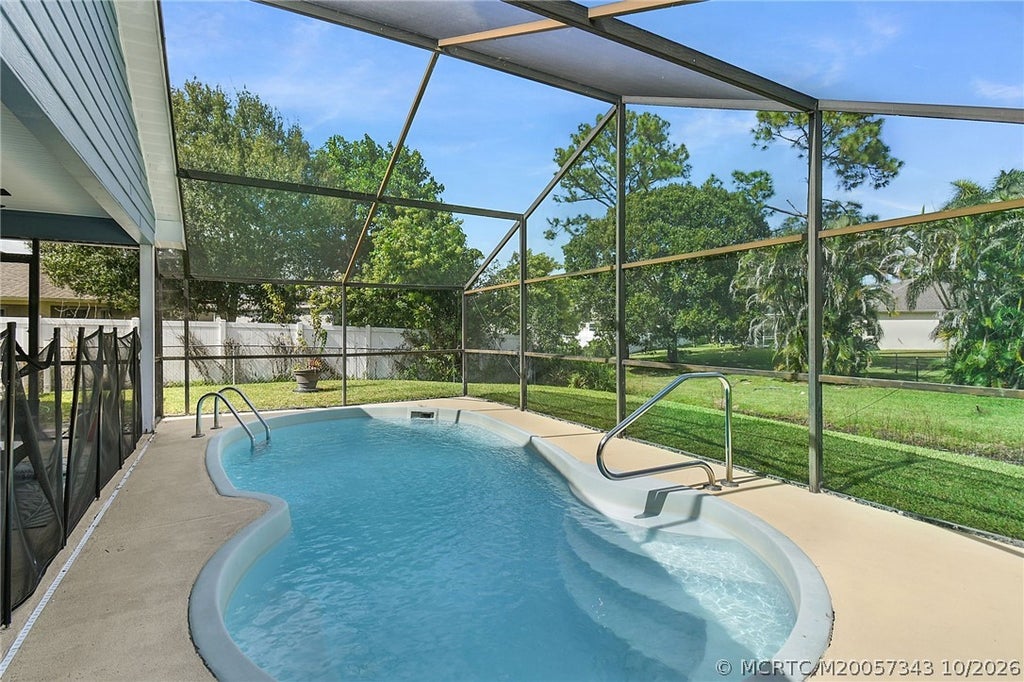 Photo of 2367 SW Madrid Road, Port Saint Lucie, FL 34953 (MLS # M20057343)