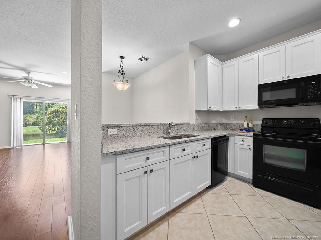 Photo of 1560 SE Hampshire Way #101, Stuart, FL 34994 (MLS # M20036032)