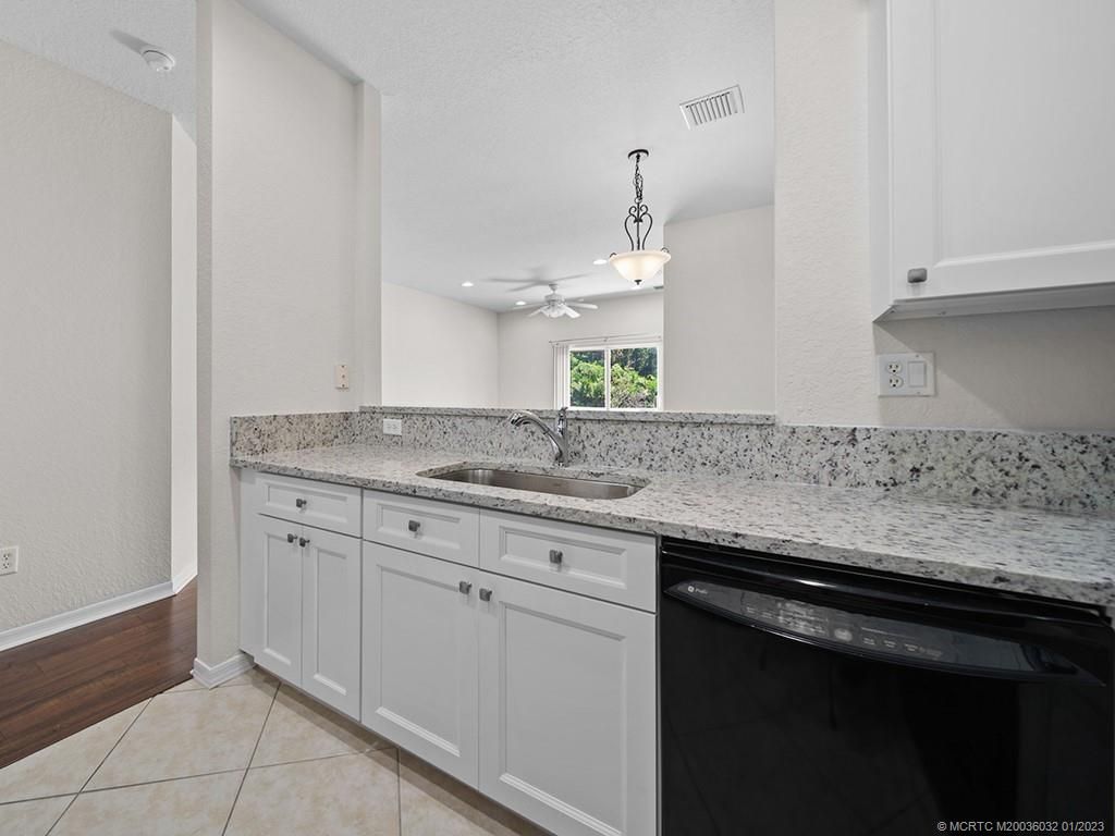 Photo of 1560 SE Hampshire Way #101, Stuart, FL 34994 (MLS # M20036032)