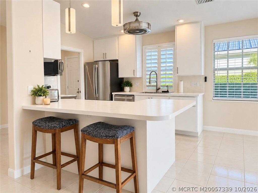 Photo of 1648 SW Waterfall Boulevard, Palm City, FL 34990 (MLS # M20057339)