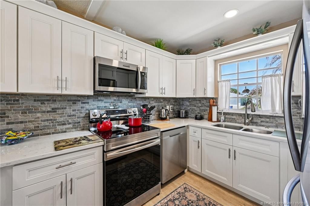 Photo of 1572 NE 22nd Street, Jensen Beach, FL 34957 (MLS # M20054852)