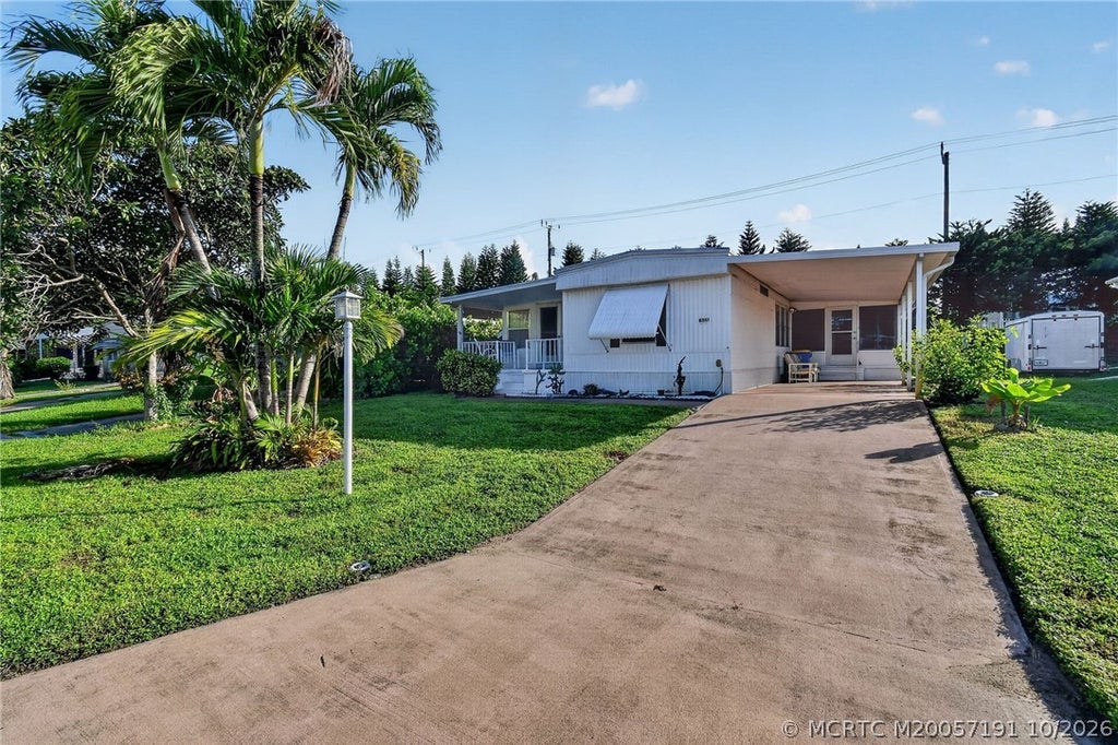 Photo of 8051 SE Homestead Avenue, Hobe Sound, FL 33455 (MLS # M20057191)