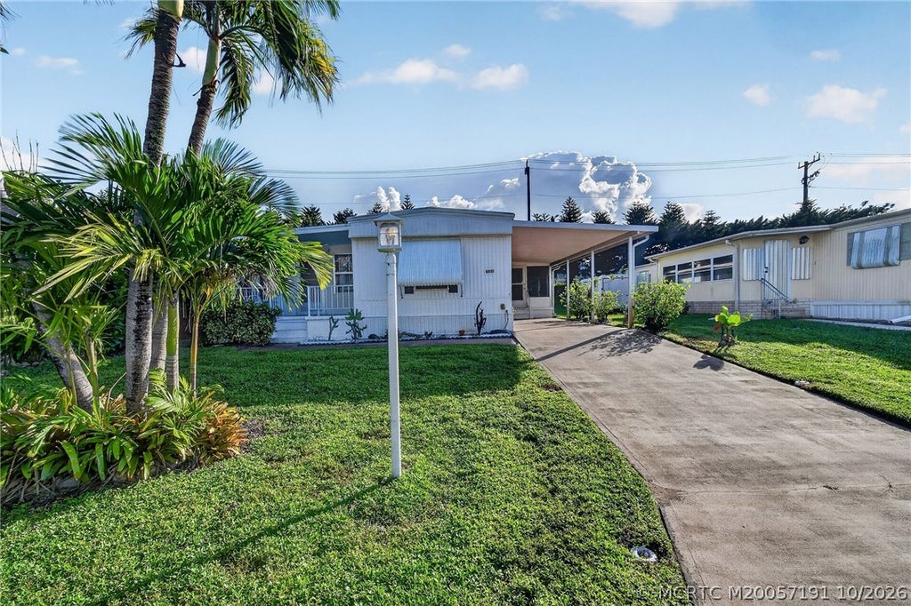 Photo of 8051 SE Homestead Avenue, Hobe Sound, FL 33455 (MLS # M20057191)
