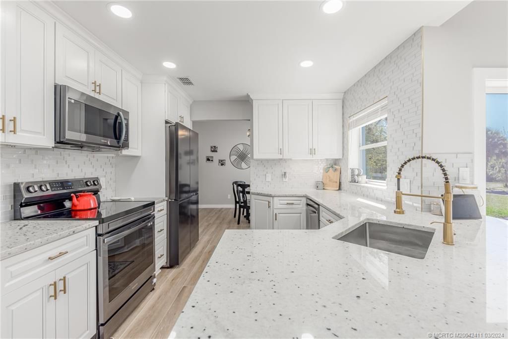 Photo of 6104 SW Woodham Street, Palm City, FL 34990 (MLS # M20042411)