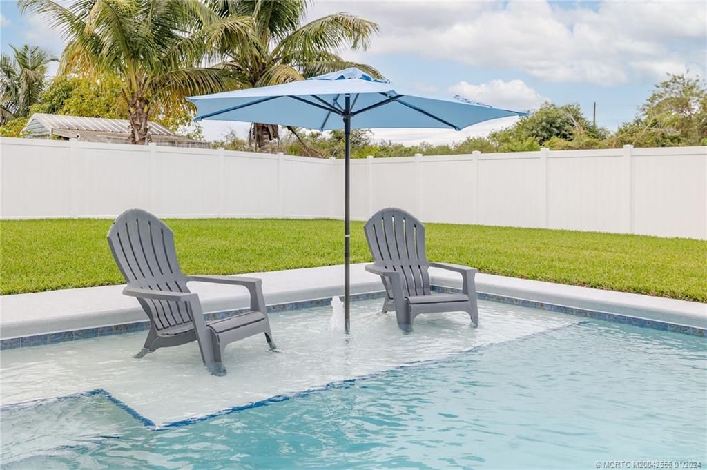 Photo of 4250 SW Jame Street, Port Saint Lucie, FL 34953 (MLS # M20042556)