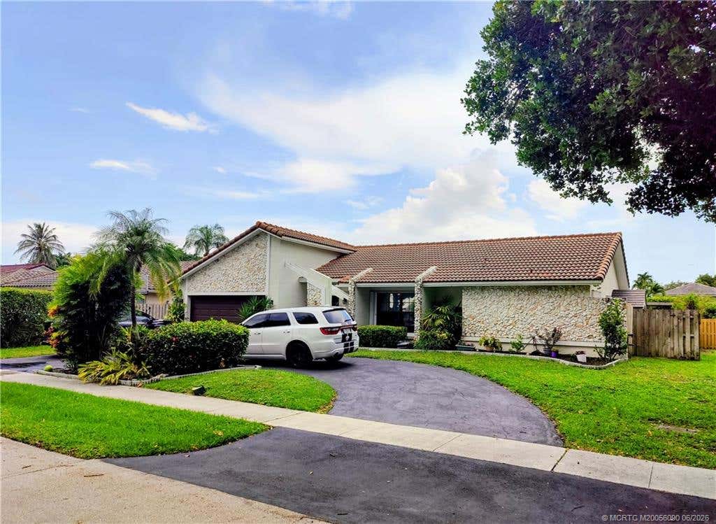 Photo of 9780 NW 10th Street, Fort Lauderdale, FL 33322 (MLS # M20056090)