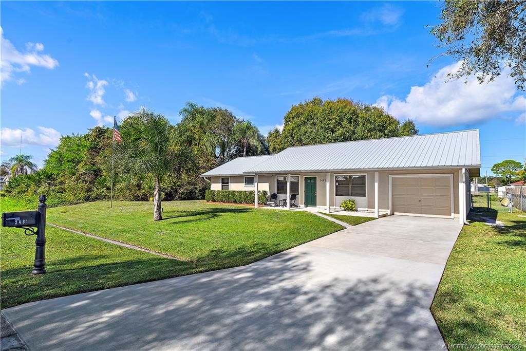 Photo of 2481 SE Calusa Avenue, Port Saint Lucie, FL 34952 (MLS # M20053586)