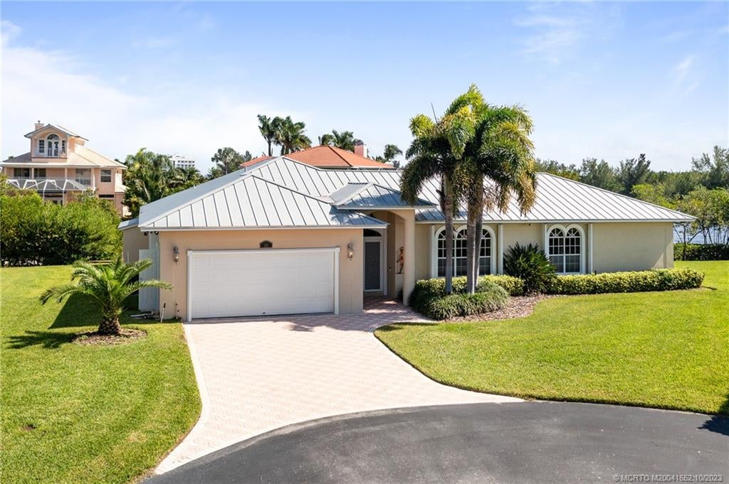 Photo of 103 Aqua Ra Drive, Jensen Beach, FL 34957 (MLS # M20041652)