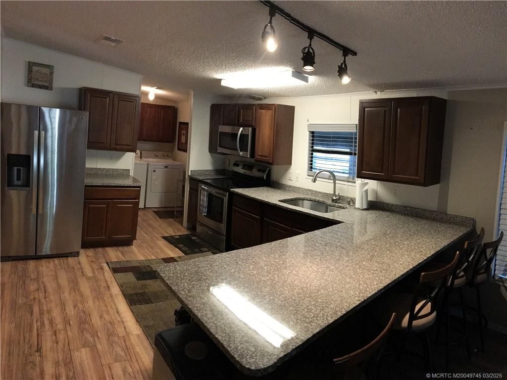 Photo of 15960 SW Indianwood Cir Circle #F-46, Indiantown, FL 34956 (MLS # M20049745)