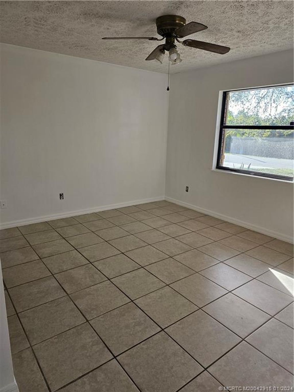 Photo of 107 NW Friar Street, Port Saint Lucie, FL 34983 (MLS # M20042915)