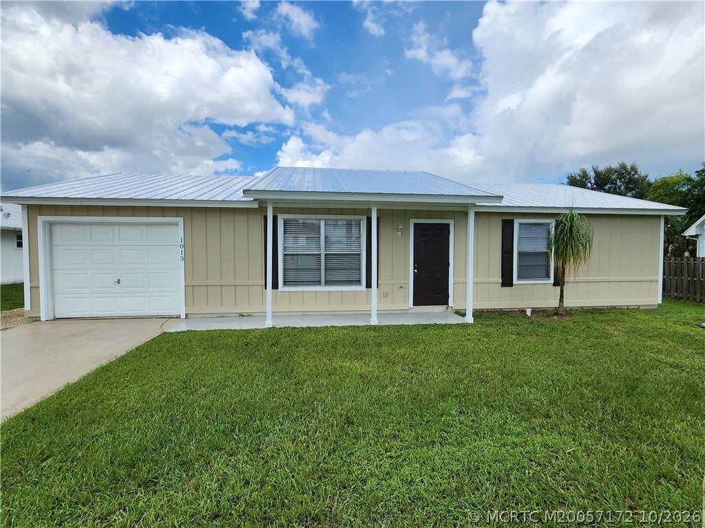 Photo of 1013 SW California Boulevard, Port Saint Lucie, FL 34953 (MLS # M20057172)