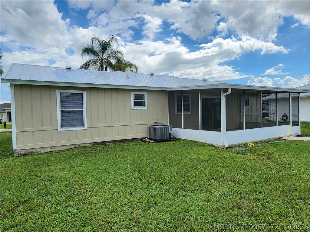 Photo of 1013 SW California Boulevard, Port Saint Lucie, FL 34953 (MLS # M20057172)