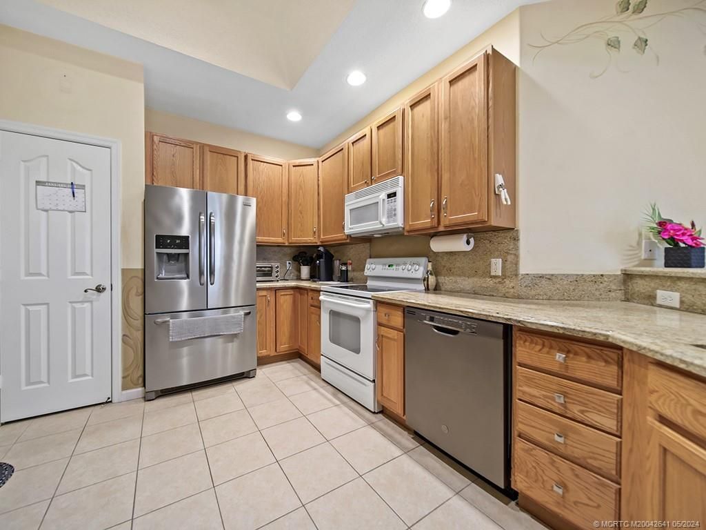 Photo of 570 NW Red Pine Way, Jensen Beach, FL 34957 (MLS # M20042641)