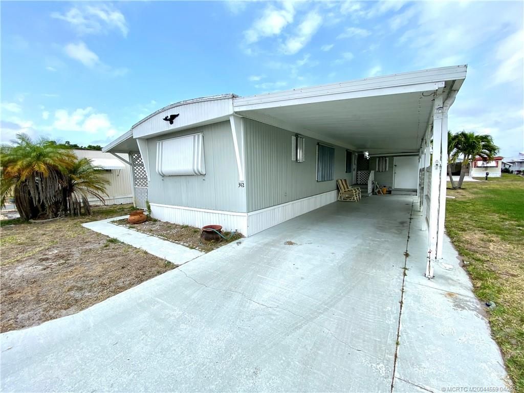 Photo of 342 NE Tropicalia Lane, Jensen Beach, FL 34957 (MLS # M20044559)