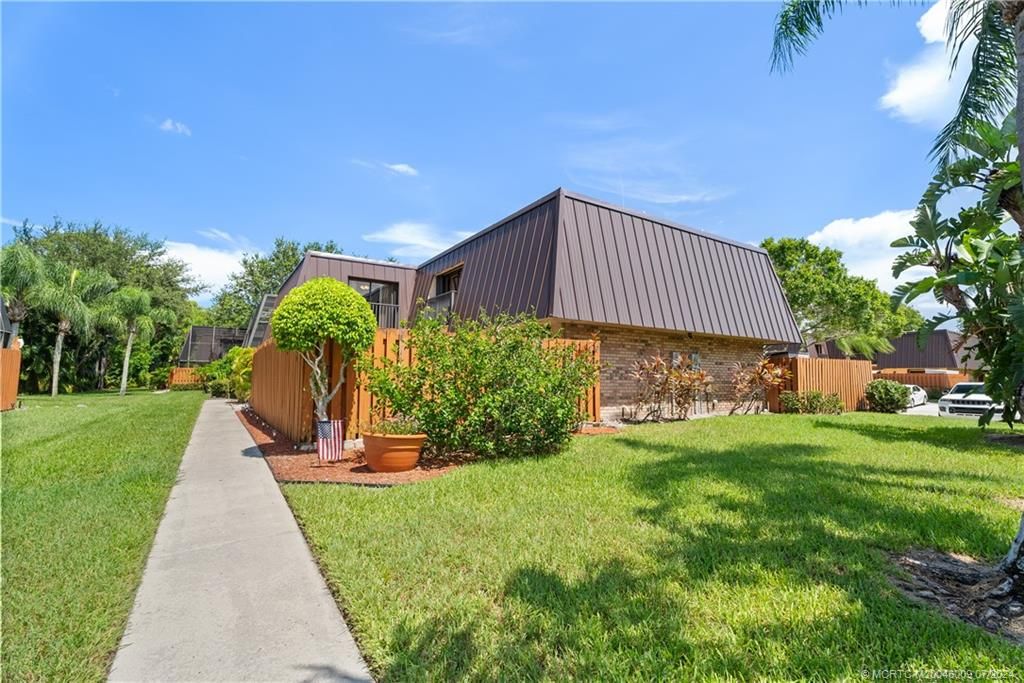 Photo of 6119 SE Windsong Lane #1015, Stuart, FL 34997 (MLS # M20046009)