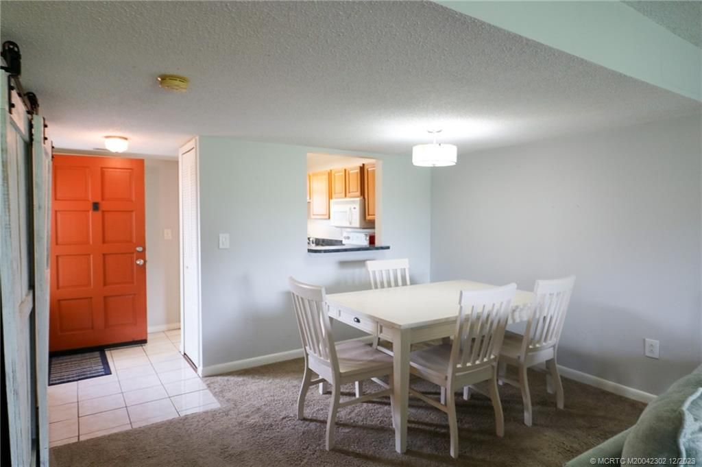 Photo of 5433 SE Miles Grant Road #203, Stuart, FL 34997 (MLS # M20042302)