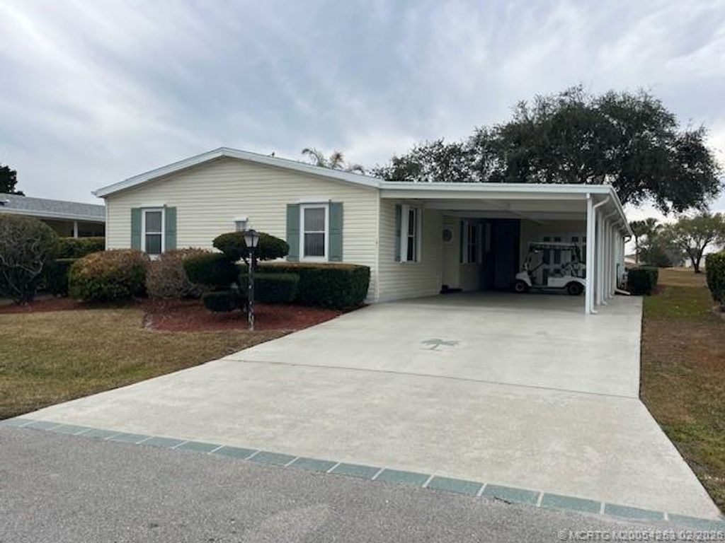 Photo of 7921 Meadowlark Lane, Port Saint Lucie, FL 34952 (MLS # M20054253)