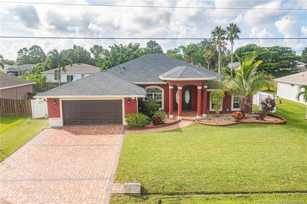 Photo of 1550 SW Mullinax Avenue, Port Saint Lucie, FL 34953 (MLS # M20046652)