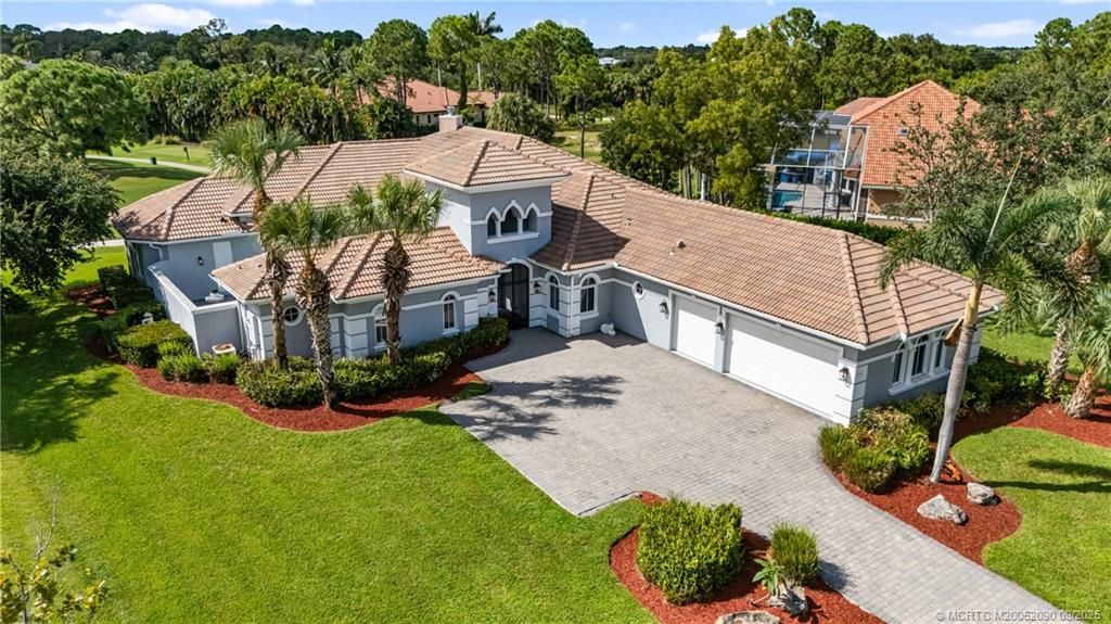 Photo of 872 SW Squire Johns Lane N #A, Palm City, FL 34990 (MLS # M20052090)