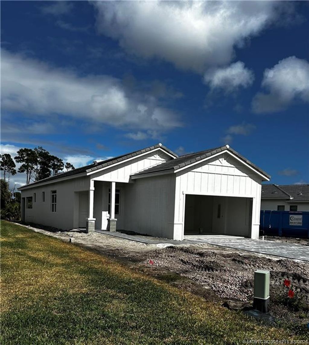 Photo of 435 SE Via Sangro, Port Saint Lucie, FL 34952 (MLS # M20054215)